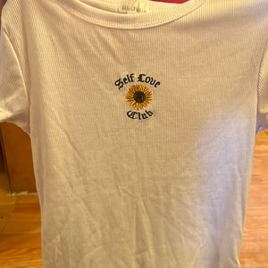 Tshirt that says “self love club”. In perfect condition